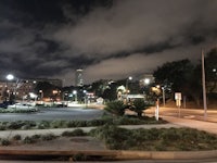 a view of a city at night with a cloudy sky